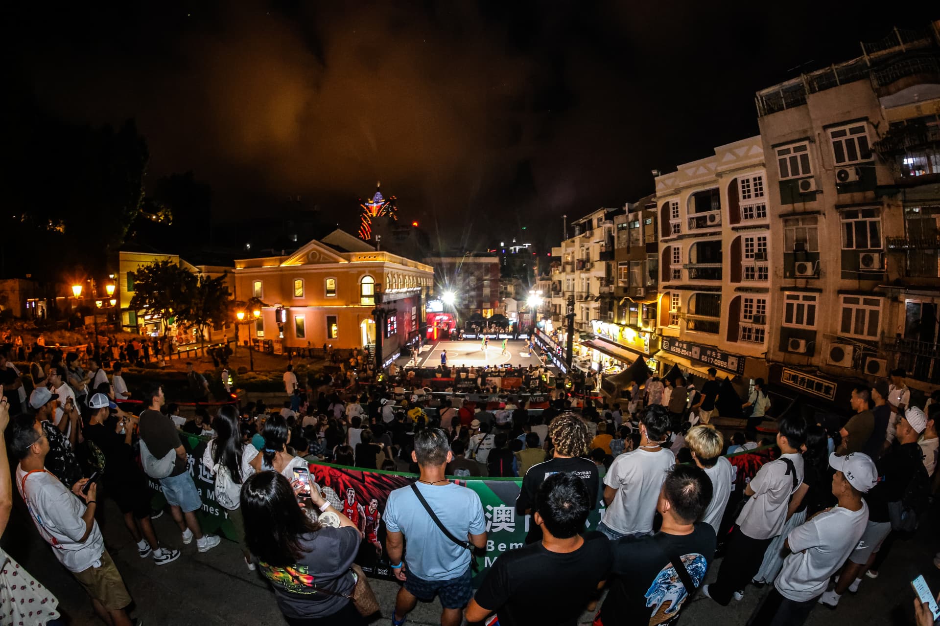 Spectators watching a night session in Macau